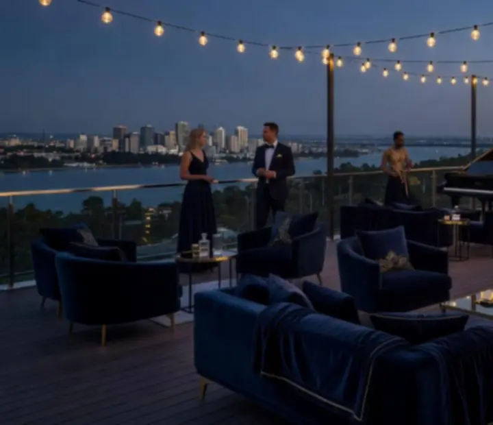 Rooftop event setting in Australia with ambient lighting, lounge seating, and views of the city
